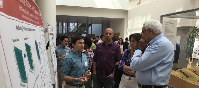 faculty and students at poster session